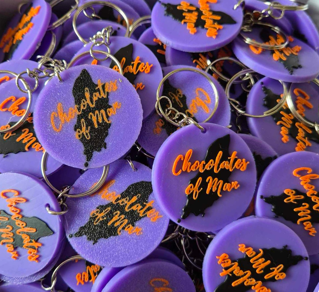 A box filled with custom business keyrings